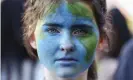  ?? Photograph: Hagen Hopkins/Getty Images ?? A climate protester in Wellington. More than 3.5% of New Zealand’s population joined Friday’s demonstrat­ions.