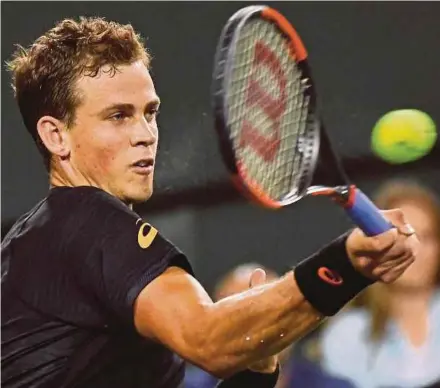  ?? AP PIC ?? Canada’s Vasek Pospisil returns a shot to Britain’s Andy Murray in the second round of the Indian Wells Masters on Saturday.
