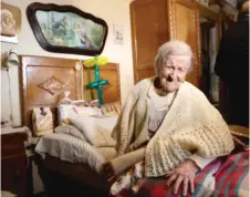  ??  ?? In a photo taken on Nov. 29, 2016, Emma Morano sits in her home on the day of her 117th birthday in Verbania, Italy. | ANTONIO CALANNI/ AP