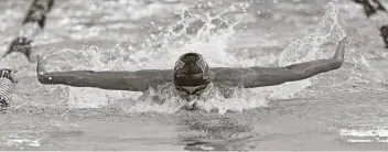  ?? Ronald Cortes / Contributo­r ?? The Woodlands senior Tyler Hulet finished third in the 100-yard butterfly and later won the 100-yard backstroke before placing third in the 400-yard freestyle relay, helping his team to the state title.