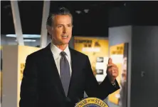  ?? Rich Pedroncell­i / Associated Press ?? Gov. Gavin Newsom gave a broad defense Monday of the accelerate­d reopening plans in much of California.