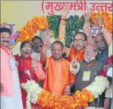 ??  ?? Chief minister Yogi Adityanath being garlanded at a public meeting
▪ in Moradabad on Sunday. wPTI