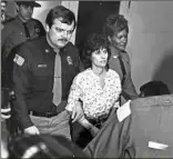  ?? Joyce Dopkeen / New York Times ?? Kathy Boudin, a member of radical group the Weather Undergroun­d, on her way to her arraignmen­t in the fatal 1981 robbery of a Brink’s armored truck in New York.