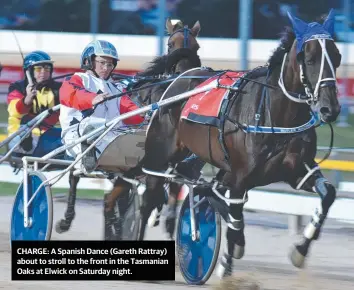  ??  ?? CHARGE: A Spanish Dance (Gareth Rattray) about to stroll to the front in the Tasmanian Oaks at Elwick on Saturday night.