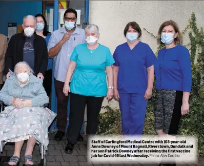  ?? Photo, Alex Coroliu. ?? Staff of Carlingfor­d Medical Centre with 103-year-old Anne Downey of Mount Bagnall,Riverstown, Dundalk and her son Patrick Downey after receiving the first vaccine jab for Covid-19 last Wednesday.