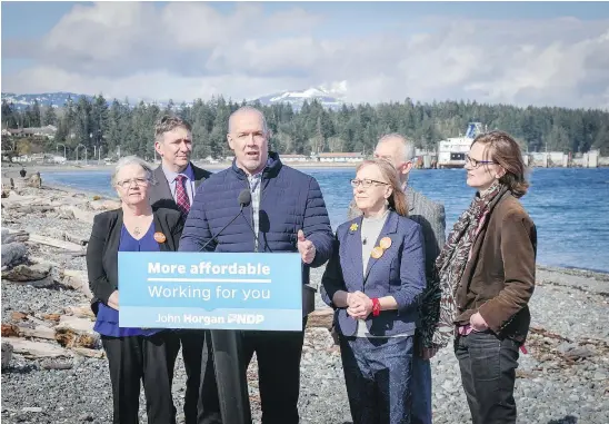  ?? NICK EAGLAND/PNG ?? NDP Leader John Horgan campaigns with Island NDP candidates in Comox on Friday.