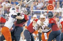  ?? ROBERT MAYER/USA TODAY SPORTS ?? Left offensive tackle Reggie Bain, here defending in a game, was injured in a car accident on Friday. He had started every game in his FAU career.