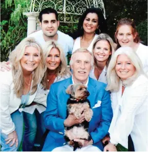  ??  ?? Sir Bruce with his family: Back row, from left – JJ, Lady Wilnelia and Charlotte. Front row, from left – Laura, Julie, Louisa and Debbie