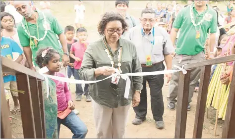  ??  ?? Valerie Garrido-Lowe, Minister within the Ministry of Indigenous Peoples’ Affairs unties the ribbon at the Kezeé Eco-Lodge (DPI photo)