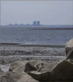  ?? DANIEL BEREHULAK/THE NEW YORK TIMES 2023 ?? The Zaporizhzh­ia Nuclear Power Plant is seen across the Dnieper River, in the Nikopol district of southern Ukraine. A drone attack on the facility has left Russia and Ukraine blaming the other side for the incident, which did not compromise the safety of the plant.