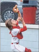  ?? Mary brannon ?? LFO catcher Grayden Johnson makes a tough catch near the backstop in a recent home victory. The Warriors began the baseball season last week with two victories over Dalton and a loss to Rome.