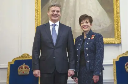  ??  ?? WELLINGTON: New Zealand Prime Minister Bill English (left) stands with the Governor-General, Dame Patsy Reddy, after being sworn-in at Government House in Wellington, New Zealand yesterday. — AP