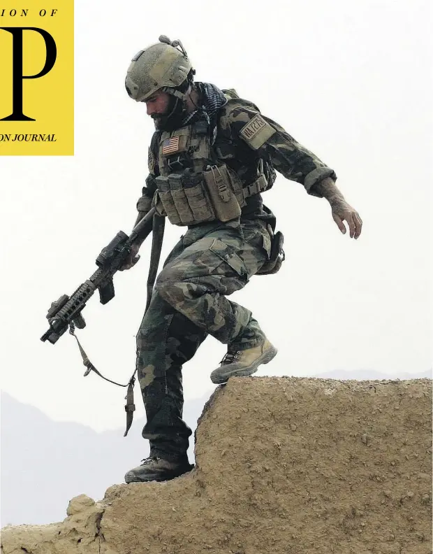  ?? MAYA ALLERUZZO / THE ASSOCIATED PRESS ?? A U.S. special op forces service member goes on joint patrol with Afghan National Army soldiers in Shewan, Farah province, in this 2009 file photo. Reversing his past calls for a speedy exit, President Donald Trump recommitte­d the U.S. to the...