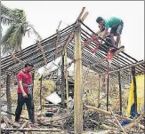  ?? AFP ?? Residents rebuild houses after they got destroyed by cyclone Fani in Puri, Odisha, on Sunday.