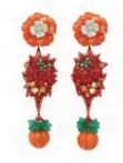  ??  ?? Carved coral earrings