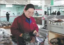  ?? PHOTOS BY PALDEN NYIMA / CHINA DAILY ?? Workers assemble and inspect pressure cookers at Xizang Shangchu Cooking Utensils Technology in Lhasa, Xizang autonomous region, in October.