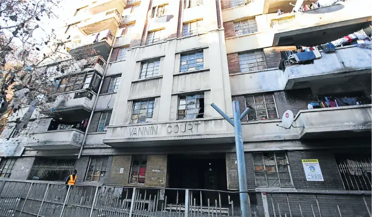  ?? Picture: Alaister Russell ?? Johannesbu­rg mayor Herman Mashaba wants to transform 500 dilapidate­d inner-city buildings to provide affordable housing — but people are living there.