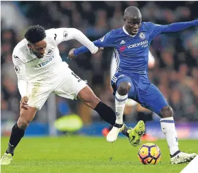  ??  ?? Leroy Fer, left, tries to get the ball away from N’Golo Kante.