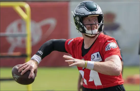  ?? ASSOCIATED PRESS ?? In his fifth season in the NFL, Eagles quarterbac­k Carson Wentz, in action at training camp Sunday, has embraced his role as a veteran leader on the team.
