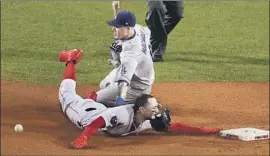  ?? Robert Gauthier Los Angeles Times ?? MOOKIE BETTS of the Boston Red Sox steals second base in the first inning. “Right off the bat, we’re running 100 miles an hour,” Betts said.