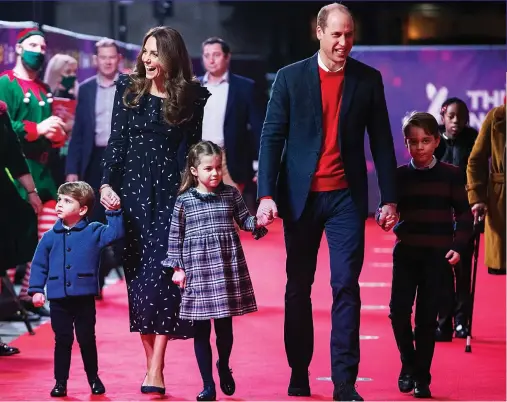  ??  ?? Five at the Palladium: William and Kate walk their children down the royal red carpet in the West End last night