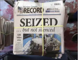  ?? JOHN HANNA THE ASSOCIATED PRESS ?? A stack of the latest weekly edition of the Marion County Record sits in the back of the newspaper's building, awaiting unbundling, sorting and distributi­on, Wednesday, in Marion, Kan. The newspaper's front page was dedicated to two stories about a raid by local police on its offices and the publisher's home on Aug. 11.