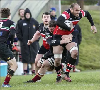  ??  ?? De La Salle’s Alexander Gregory tackles Wicklow’s George Naoupu during the Leinster league Division 1A at Ashtown, Wicklow. Picture: Garry O’Neill