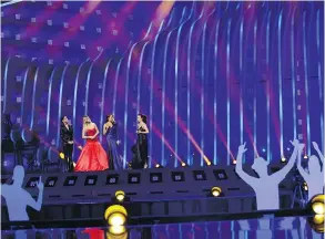  ?? ARMANDO FRANCA / THE ASSOCIATED PRESS ?? From left, presenters Daniela Ruah, Silvia Alberto, Catarina Furtado and Filomena Cautela on stage in Lisbon Monday at a dress rehearsal for the Eurovision contest.