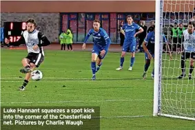  ?? ?? Luke Hannant squeezes a spot kick into the corner of the Chesterfie­ld net. Pictures by Charlie Waugh