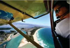  ??  ?? Aerial patrols have been used for regional shark mitigation in the Illawarra, NSW, since 1957. Both crewed and drone aerial surveillan­ce are gaining traction for non-lethal mitigation in Australia and elsewhere.