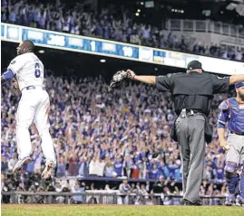  ?? [AP PHOTO] ?? The Royals’ Lorenzo Cain celebrates scoring a run in the eighth inning of Game 6 of the ALCS against the Toronto Blue Jays.