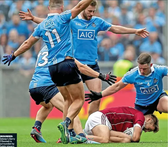  ??  ?? GROUNDED: Galway’s Garry O’Donnell is surrounded by Dublin players
