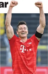  ?? (AFP) ?? Bayern Munich’s Polish forward Robert Lewandowsk­i (right) is now the league’s top-scorer with 28 goals to his name.