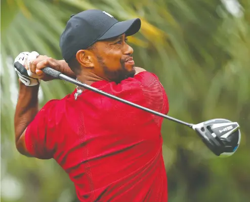  ?? MIKE EHRMANN / GETTY IMAGES FILES ?? After four knee surgeries and four operations on his back, Tiger Woods has plenty of experience coming back to the Pro Tour after a prolonged layoff.