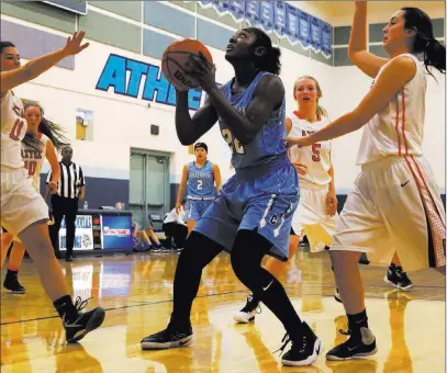  ?? Christian K. Lee ?? Las Vegas Review-journal file Centennial High wing Eboni Walker prepares to shoot inside during a Las Vegas Holiday Classic game in December 2016.