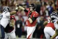  ?? DAVID GOLDMAN — THE ASSOCIATED PRESS ?? Atlanta Falcons quarterbac­k Matt Ryan (2) works against the Seattle Seahawks during the first half of an NFL football NFC divisional playoff game, Saturday in Atlanta.