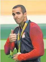  ?? ROBERT DEUTSCH, USA TODAY SPORTS ?? U. S. gymnast Danell Leyva gives a thumbs- up after one of his two medal ceremonies Tuesday.