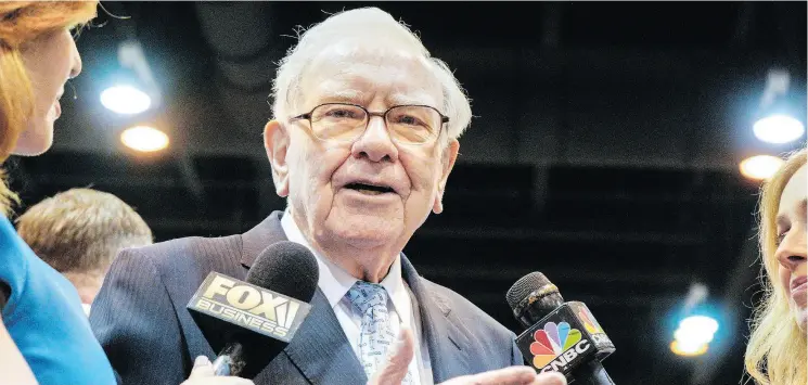  ?? NATI HARNIK / THE ASSOCIATED PRESS ?? Warren Buffett, Chairman and CEO of Berkshire Hathaway, speaks to reporters Saturday during the annual shareholde­rs meeting in Omaha, Neb.