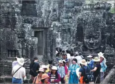 ?? PHOTOS BY JIANG DONG / CHINA DAILY ?? Tourists visit Siem Reap, Cambodia, home to Angkor Wat, a world heritage site. The Mekong Innovative Startup Tourism Initiative has launched programs to encourage tourism startups in four Southeast Asian countries, including Cambodia.
