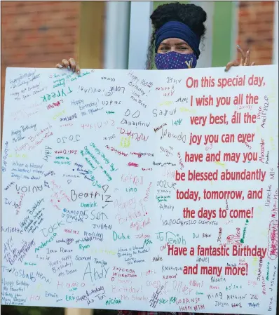  ?? ?? Students prepared a large birthday card for Faucette, a 100-year-old crossing guard. The card was given to him Sept. 29 during a celebratio­n in Greensboro.