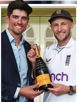  ?? ?? ■ SIR ALASTAIR COOK presented Joe Root with a special bottle of champagne yesterday for reaching 10,000 Test runs. Root tied Cook for youngest to the milestone — 31 years, 157 days.