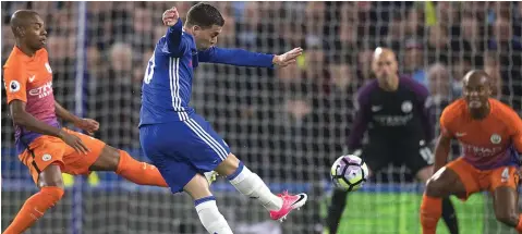  ?? Photo: BBC ?? Eden Hazards shot deflects off Vincent Kompany and past Willy Caballero in the Manchester City goal to set Chelsea on the path to a crucial win in the Premier League title race.