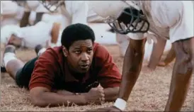  ??  ?? Denzel Washington, as coach Herman Boone, in the drama “Remember the Titans.”