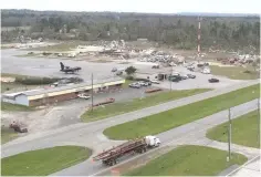  ??  ?? Debris lies on the grounds of Weedon Field, the Eufaula Municipal Airport, and alongside US Route 431 after one of two destructiv­e tornadoes passed through Lee County the previous afternoon, in an aerial photograph taken in Eufaula, Alabama. — Reuters photo