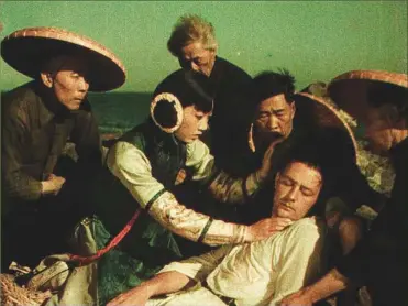  ?? (Image courtesy Wikimedia Commons.) ?? In the 1922 film The Toll of the Sea, Lotus Flower, played by Anna May Wong, rescues Allen Carver, played by Kenneth Harlan, from the sea. This film was the first full-length feature film to use color and helped introduce Wong to the world.