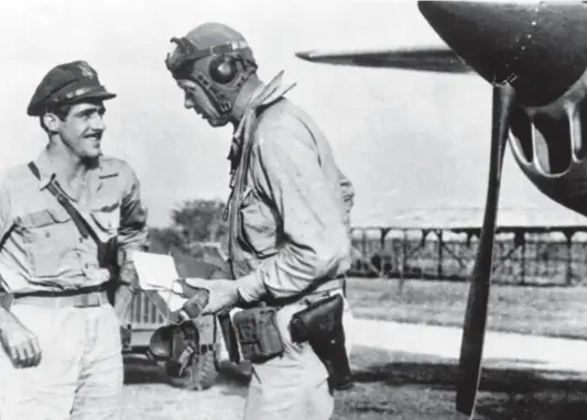  ??  ?? Major Tom McGuire, CO of the 431st FS, talking with Charles Lindberg at Sorido Airstrip on Biak Island before a combat mission during July 1944.