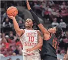  ?? JOSEPH SCHELLER/COLUMBUS DISPATCH ?? Ohio State forward Brice Sensabaugh (10) makes a shot while defended by Maryland Terrapins guard Hakim Hart (13).