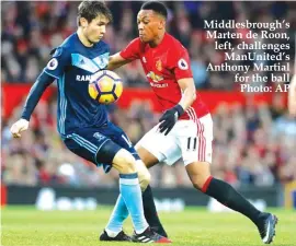  ??  ?? Middlesbro­ugh’s Marten de Roon, left, challenges ManUnited’s Anthony Martial for the ball Photo: AP