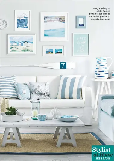  ??  ?? Hang a gallery of white-framed pictures, but stick to one colour palette to keep the look calm