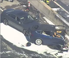  ?? COURTESY OF KGO-TV ?? A San Mateo man was killed when his Tesla crashed at the Highway 101and Highway 85 connector in Mountain View on March 23.